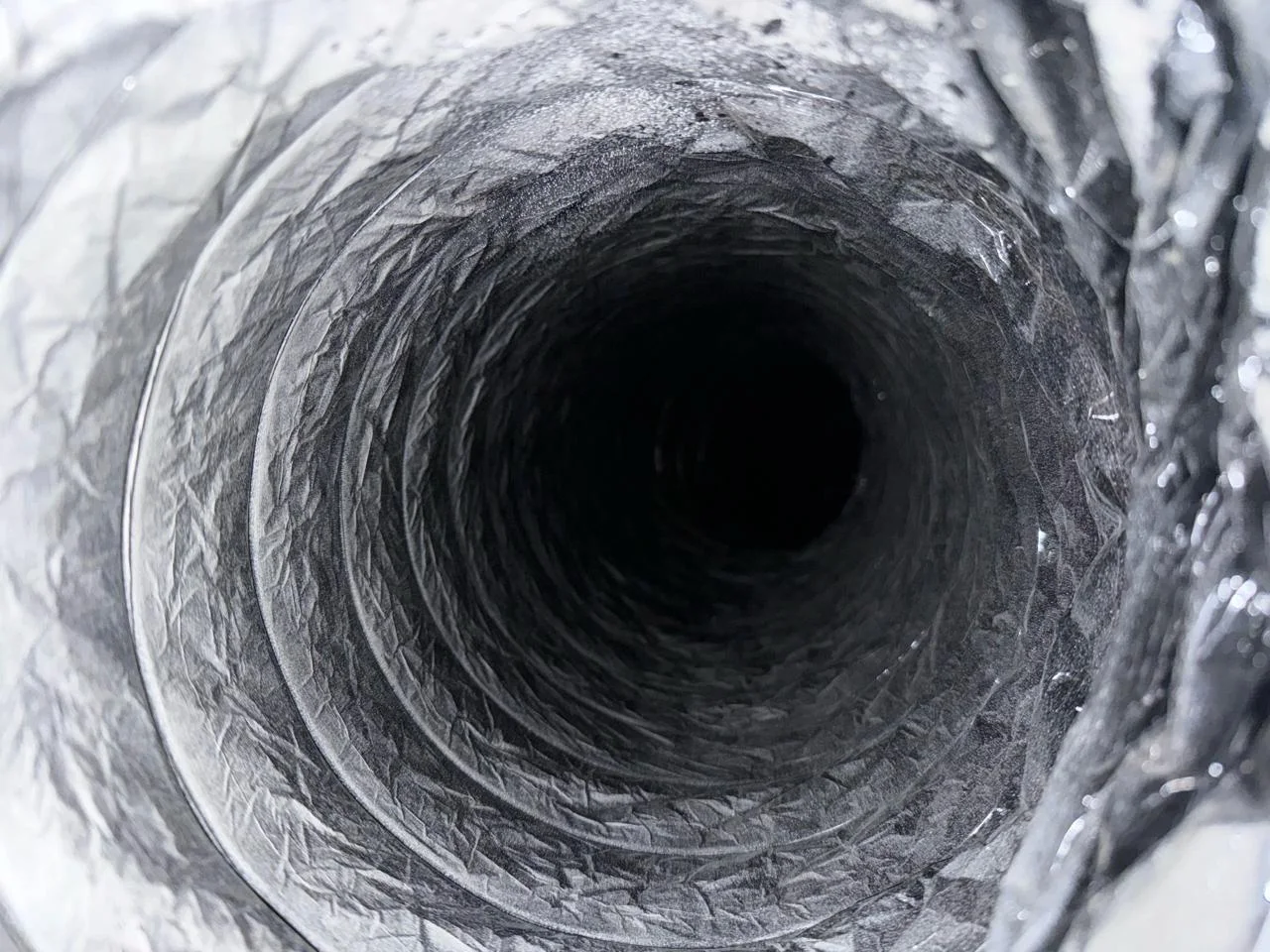 Same duct after professional cleaning — bare metal, no residue