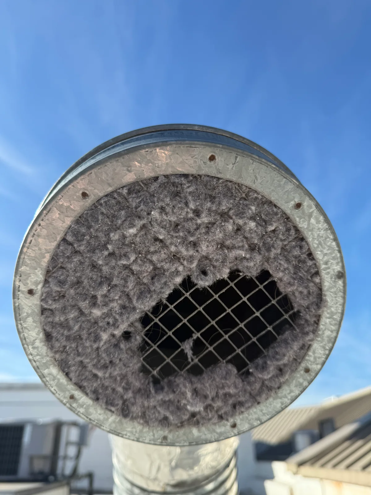 Third duct area before cleaning at Clackamas Town Center — compacted dust layer