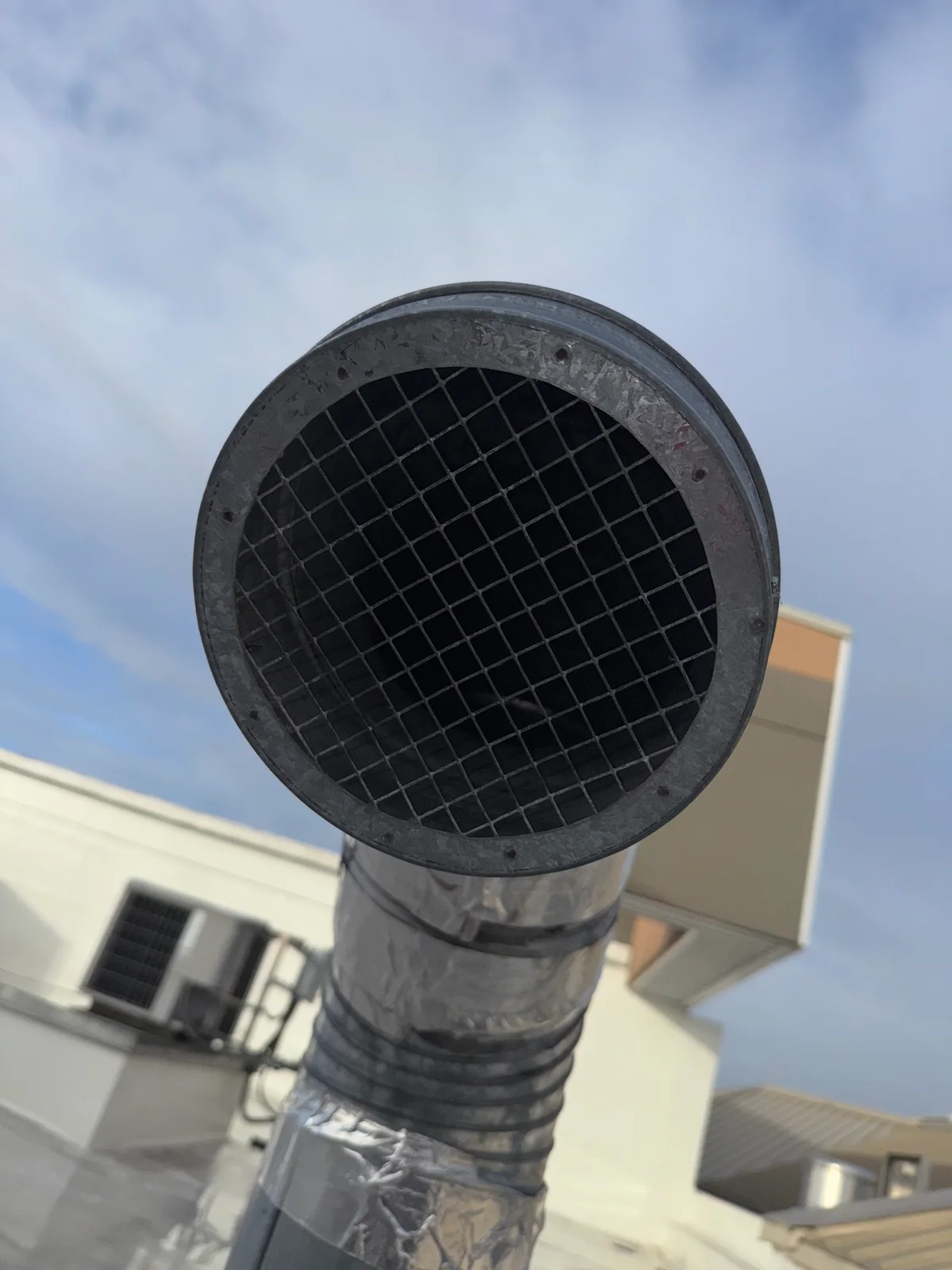 Same return section after professional cleaning — clean metal ductwork