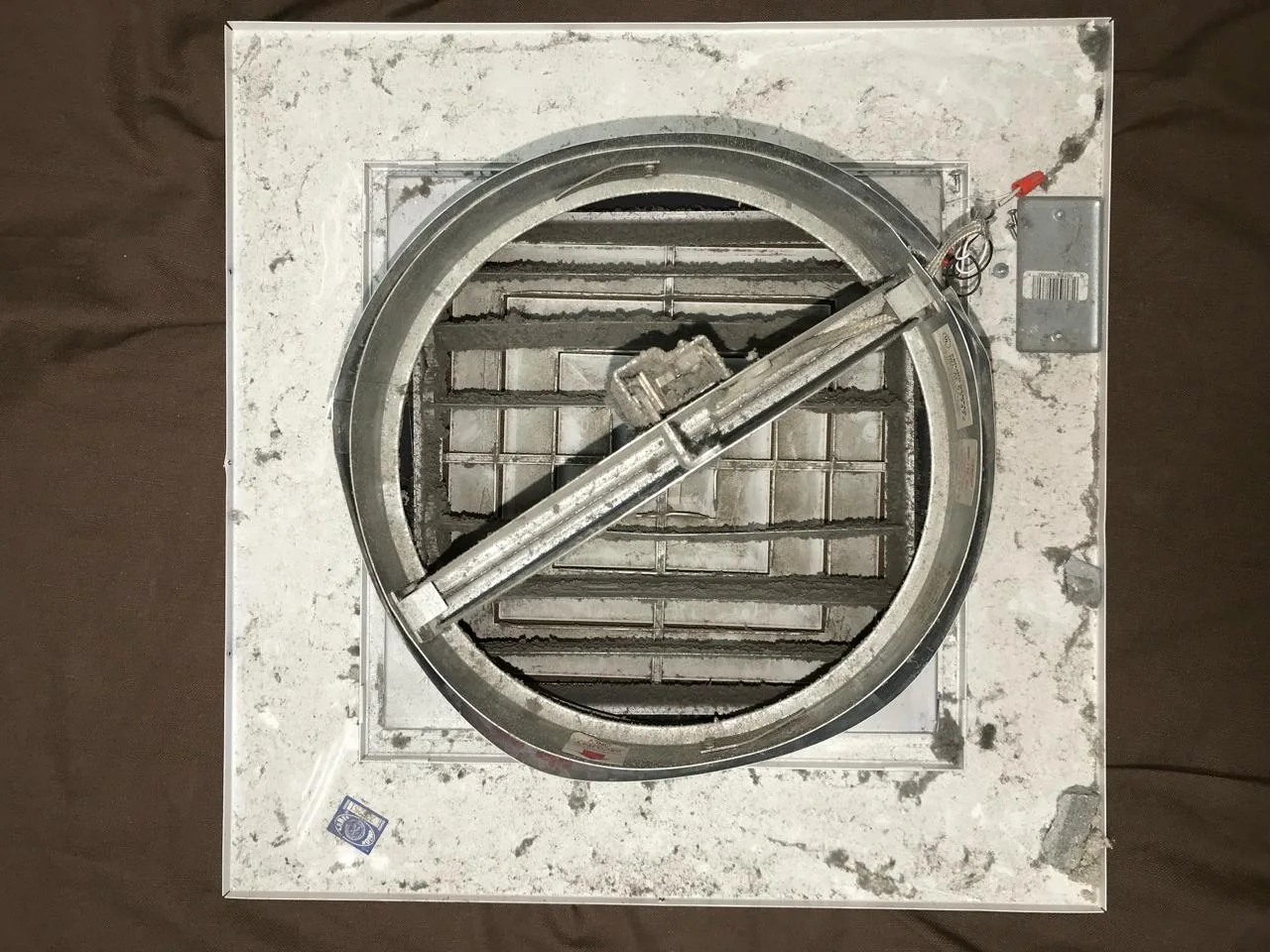 Jail duct interior before cleaning — heavy dust and debris