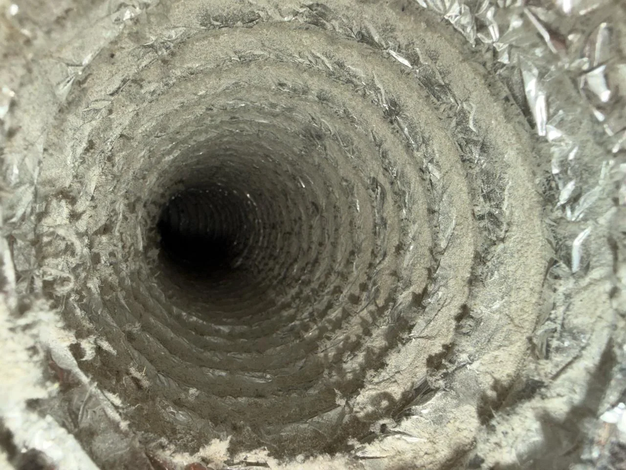 Dirty dryer vent interior at Springs Living Apartments Vancouver Waterfront — heavy lint accumulation restricting airflow